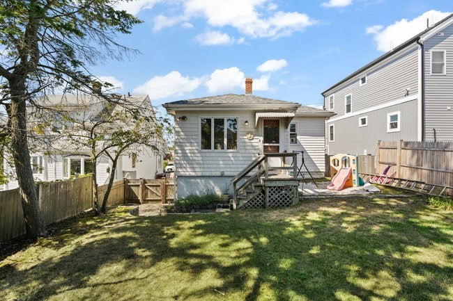 53 Windsor Street Everett, MA 02149 - Photo 17 of 20 a view of a backyard with a patio