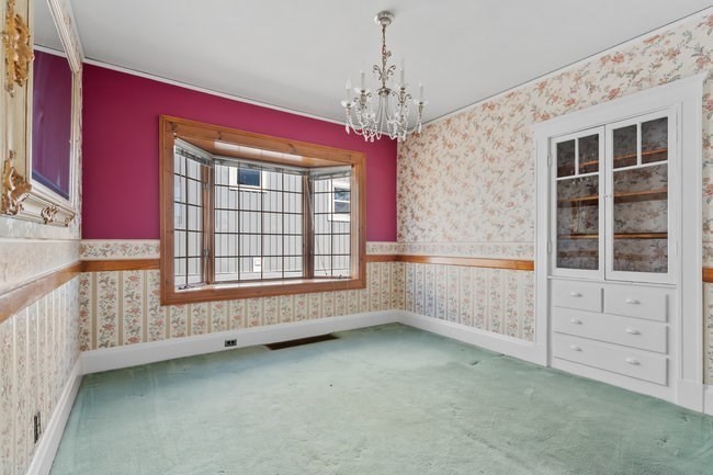 53 Windsor Street Everett, MA 02149 - Photo 4 of 20 a view of an empty room with a window