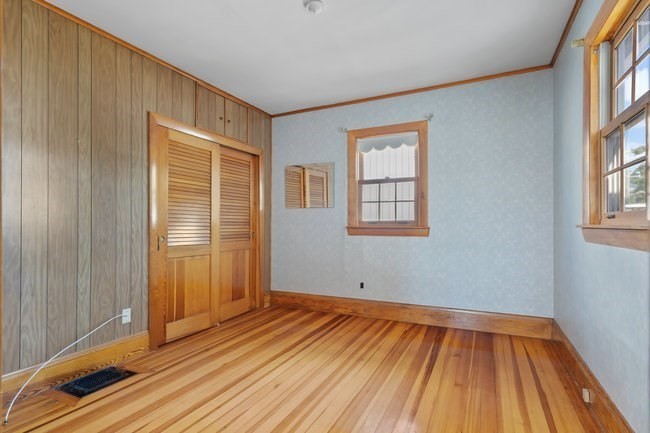 53 Windsor Street Everett, MA 02149 - Photo 8 of 20 a view of a room with wooden floor and windows