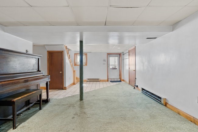 53 Windsor Street Everett, MA 02149 - Photo 9 of 20 a view of an empty room with furniture and a window