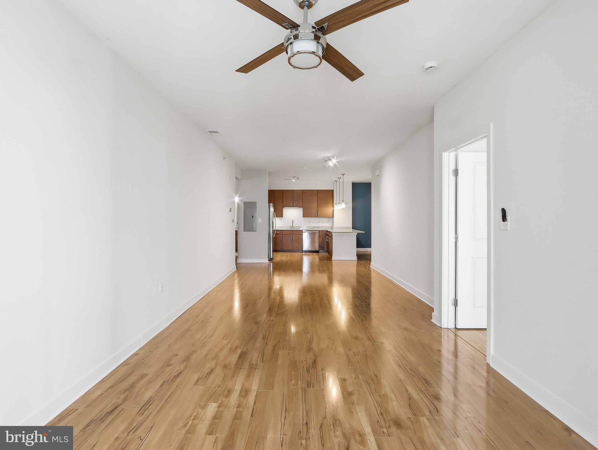 8005 13th Street, Unit 411 Silver Spring, MD 20910 - Photo 21 of 33 a view of empty room with wooden floor