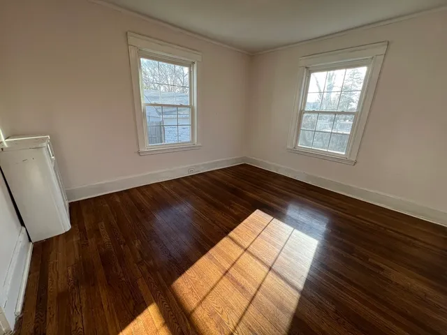 a view of wooden floor in an empty room