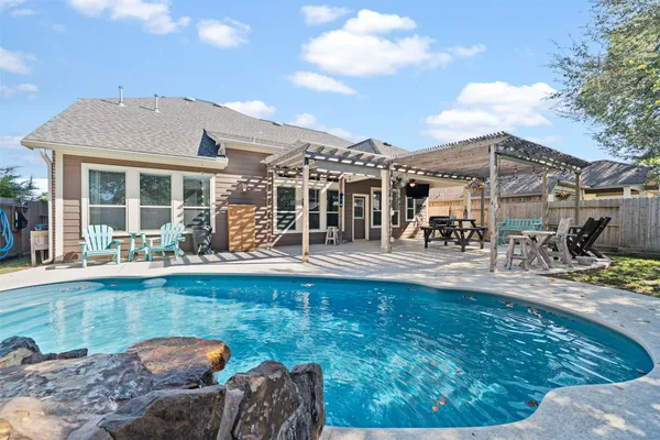 a view of a swimming pool with a lounge chairs