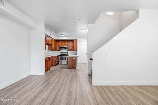 a view of kitchen with wooden floor