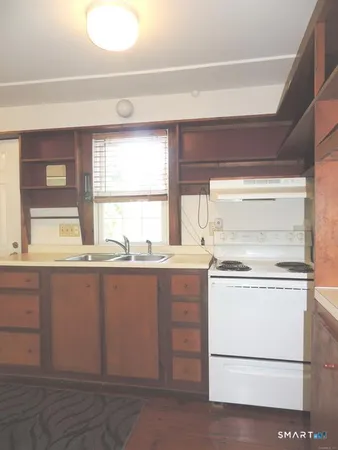 a view with cabinets window and front door