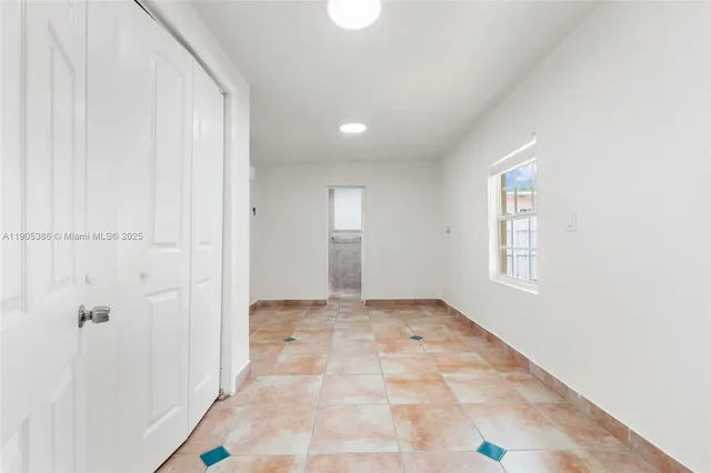 a view of an empty room and window