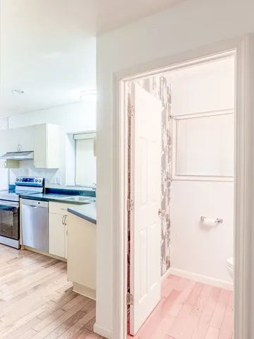 a kitchen with a sink and cabinets