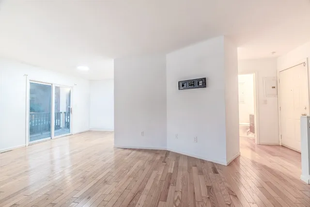 a view of a kitchen with a stove top oven