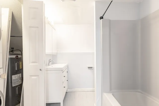 a view of a hallway with washer and dryer