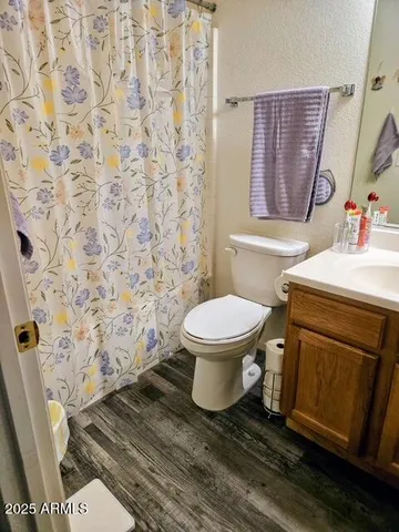 a bathroom with a toilet and a sink