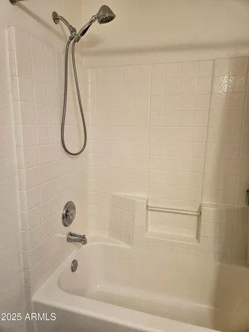 a bathroom with a bath tub