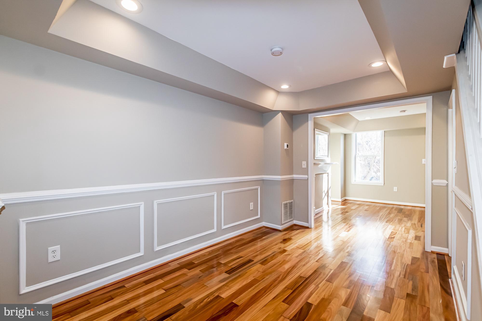 130 West Randall Street Baltimore, MD 21230 - Photo 5 of 30 a view of an empty room with wooden floor and a window