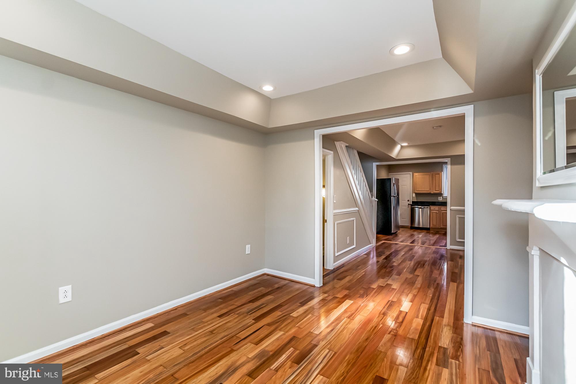 130 West Randall Street Baltimore, MD 21230 - Photo 6 of 30 a view of a room with wooden floor and a window