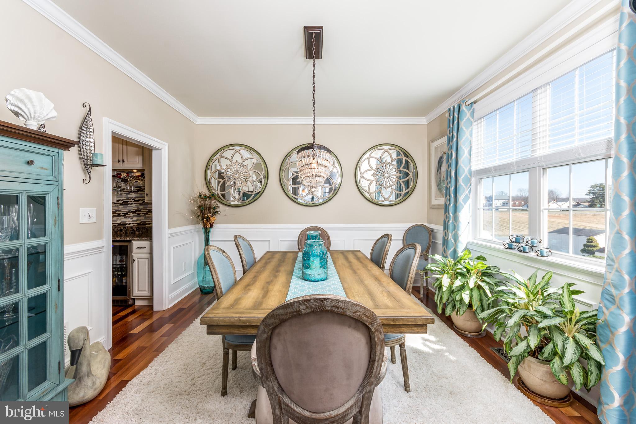 3514 Galloway Road Baltimore, MD 21220 - Photo 9 of 30 a very nice looking dining room with a table and a clock