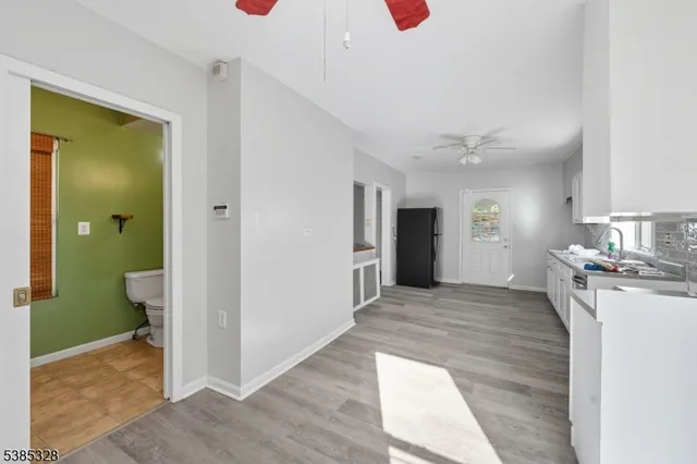 a view of a kitchen cabinets and wooden floor
