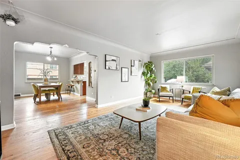 a living room with furniture and a table