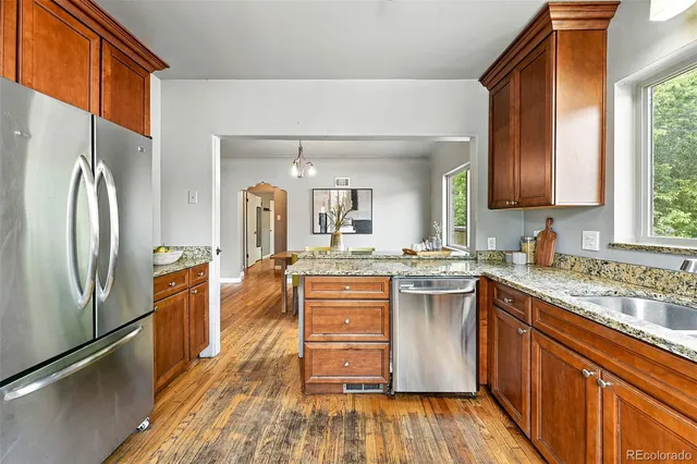 a kitchen with a sink stove and refrigerator