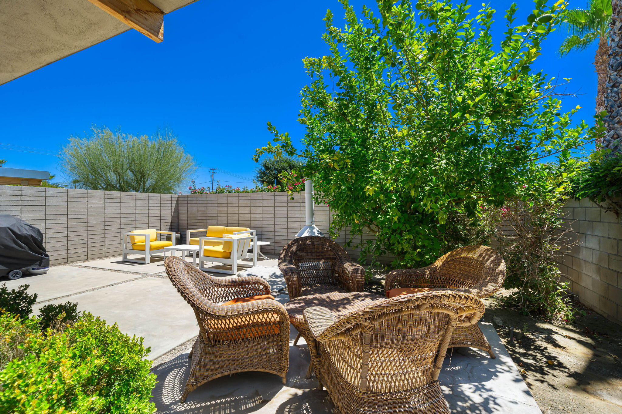 623 Desert Way Palm Springs, CA 92264 - Photo 31 of 39 a view of a patio with table and chairs and potted plants