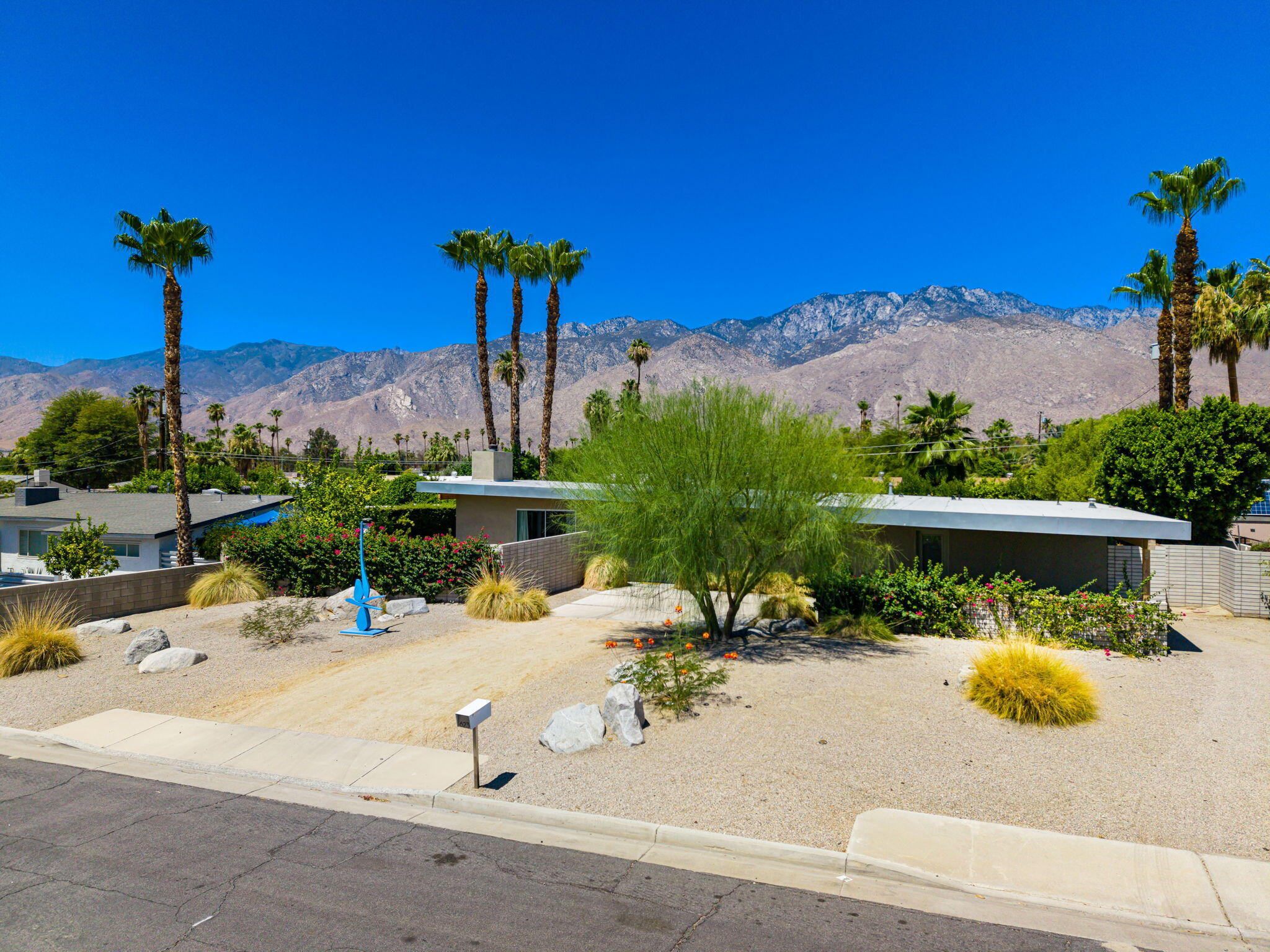 623 Desert Way Palm Springs, CA 92264 - Photo 35 of 39 a view of a swimming pool with a table and chairs