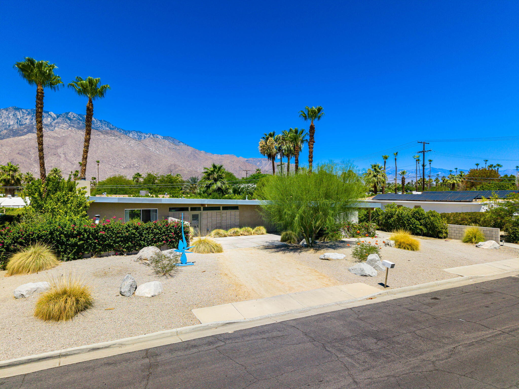 623 Desert Way Palm Springs, CA 92264 - Photo 38 of 39 a view of a lake with a water fall and palm tree