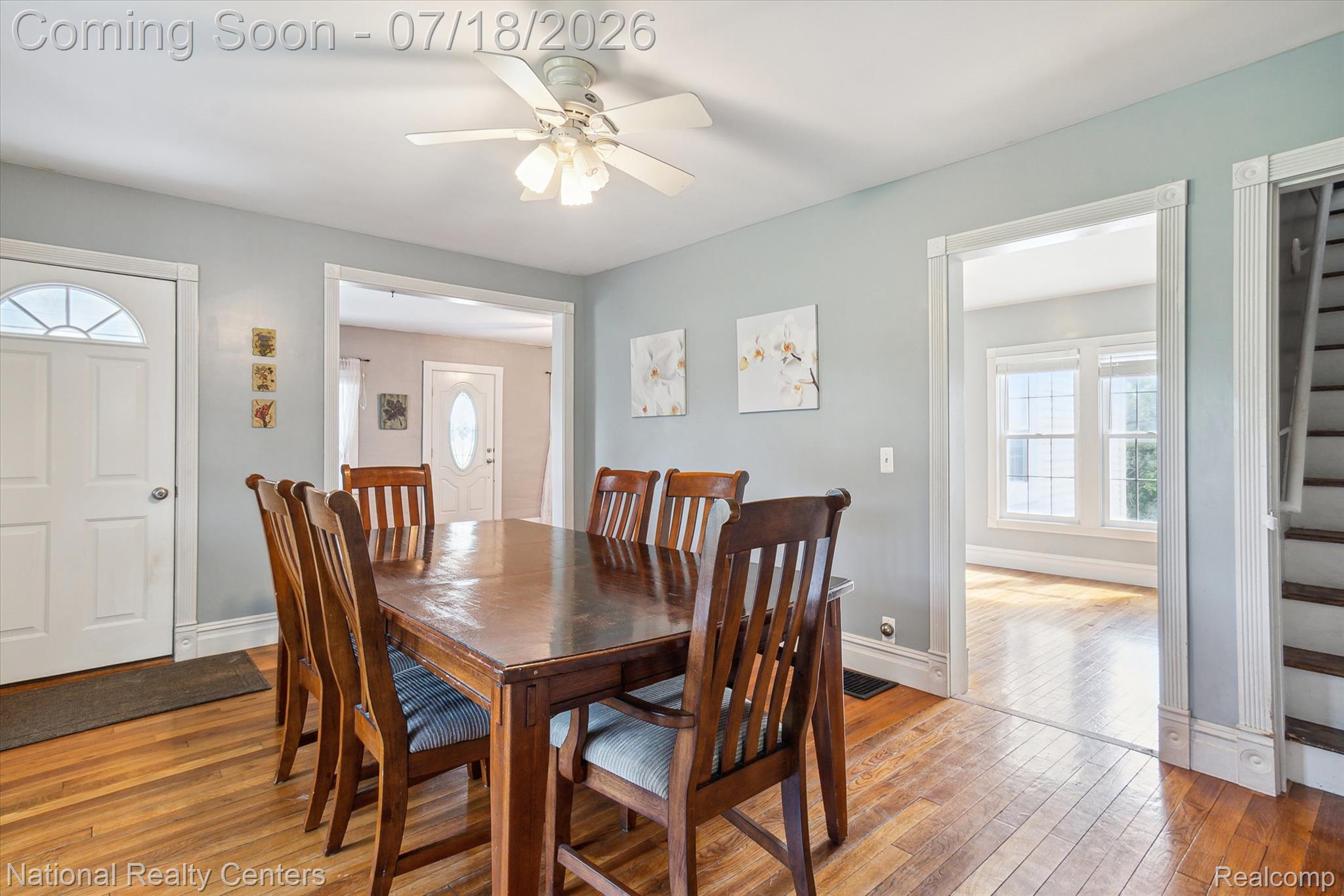 9589 Clinton Macon Road Tecumseh, MI 49286 - Photo 16 of 48 Dining area featuring wood-finish flooring, a ceiling fan with light fixture, and light-toned wall paint