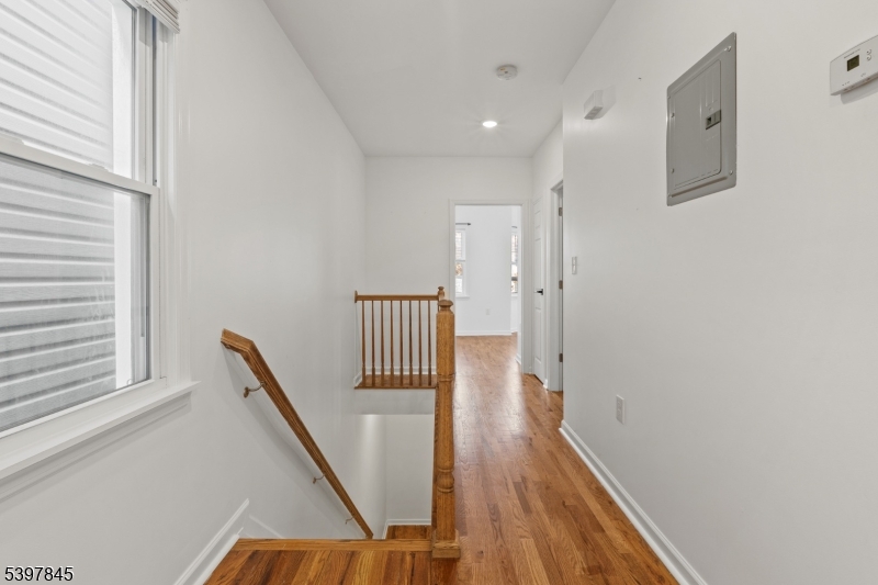 362 1/2 New Street, Unit 2 Newark, NJ 07103 - Photo 13 of 24 a view of a hallway with wooden floor and staircase