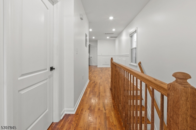 362 1/2 New Street, Unit 2 Newark, NJ 07103 - Photo 15 of 24 a view of hallway with wooden floor
