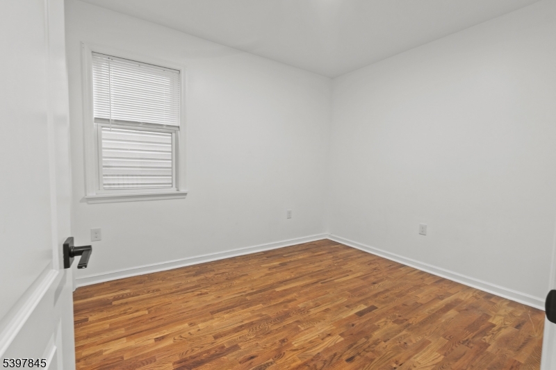 362 1/2 New Street, Unit 2 Newark, NJ 07103 - Photo 20 of 24 an empty room with a window