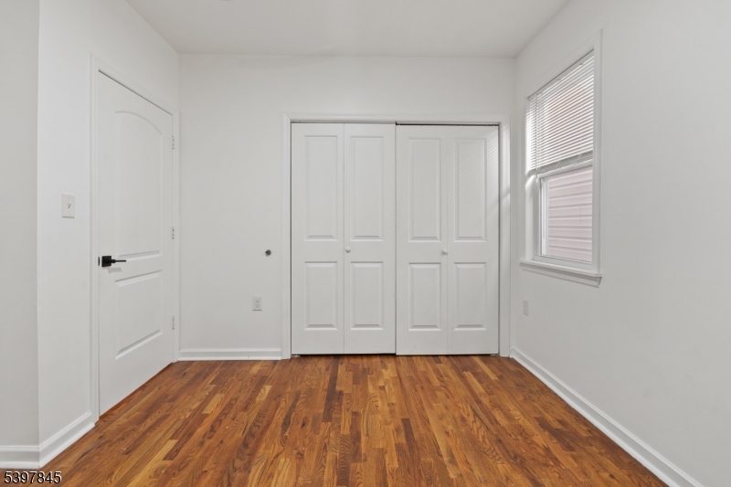 362 1/2 New Street, Unit 2 Newark, NJ 07103 - Photo 22 of 24 a view of an empty room with wooden floor