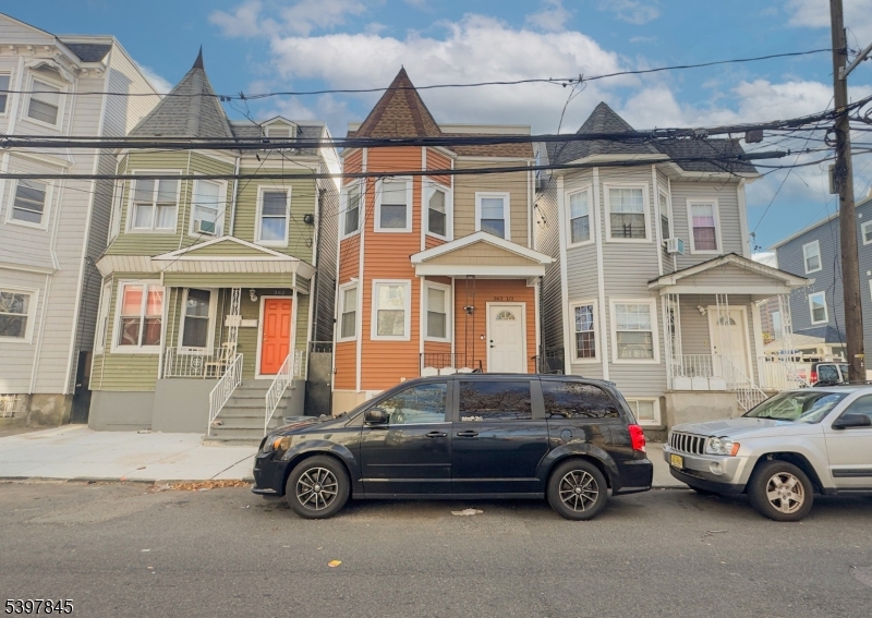 362 1/2 New Street, Unit 2 Newark, NJ 07103 - Photo 23 of 24 a car parked in front of a brick house