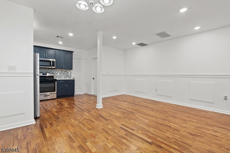 362 1/2 New Street, Unit 2 Newark, NJ 07103 - Photo 10 of 24 a view of kitchen with kitchen island microwave and stove