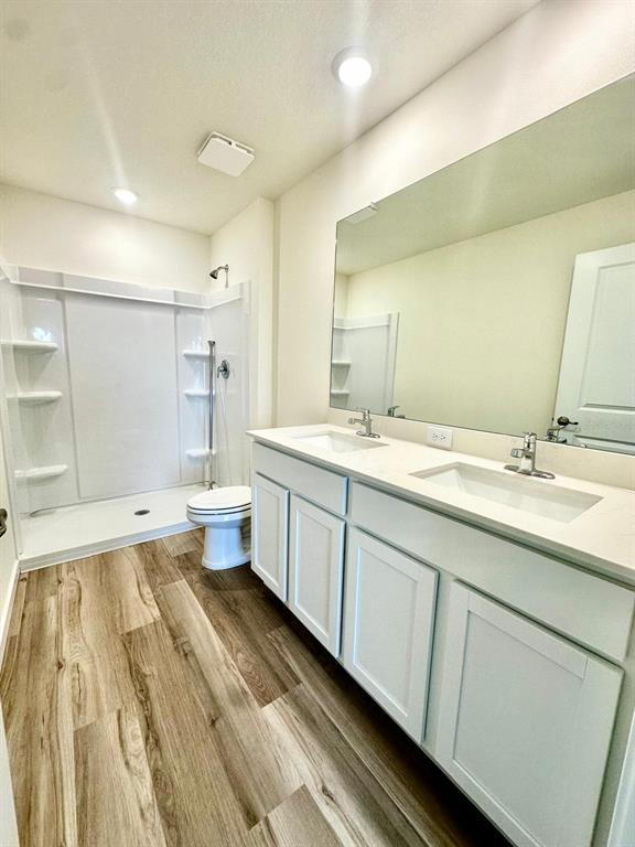 5844 Southwest 132nd Place Ocala, FL 34473 - Photo 13 of 21 a spacious bathroom with a double vanity sink a mirror and a toilet