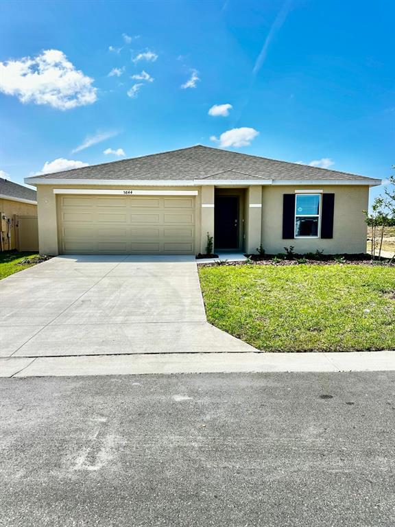 5844 Southwest 132nd Place Ocala, FL 34473 - Photo 2 of 21 a view of a house with a yard