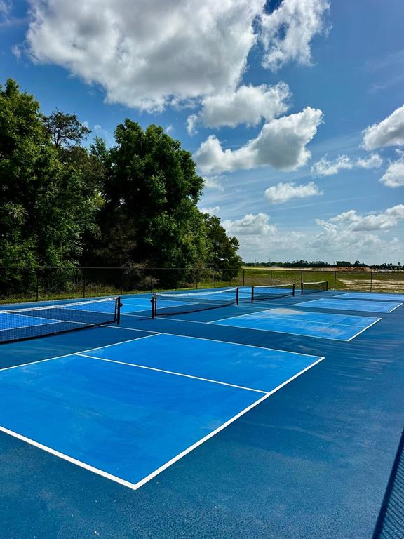 5844 Southwest 132nd Place Ocala, FL 34473 - Photo 21 of 21 a view of an outdoor space and tennis court