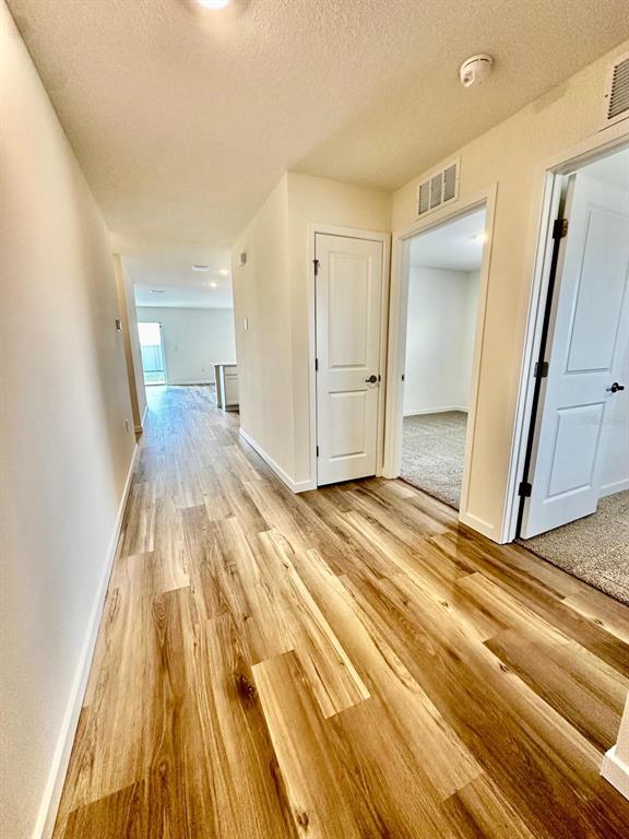 5844 Southwest 132nd Place Ocala, FL 34473 - Photo 3 of 21 a view of a bedroom from a hallway