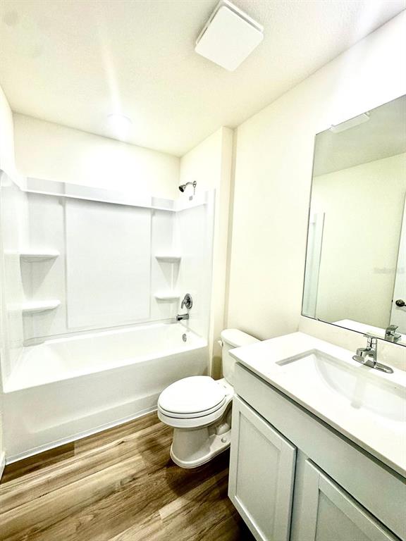 5844 Southwest 132nd Place Ocala, FL 34473 - Photo 9 of 21 a bathroom with a sink a toilet a mirror and shower