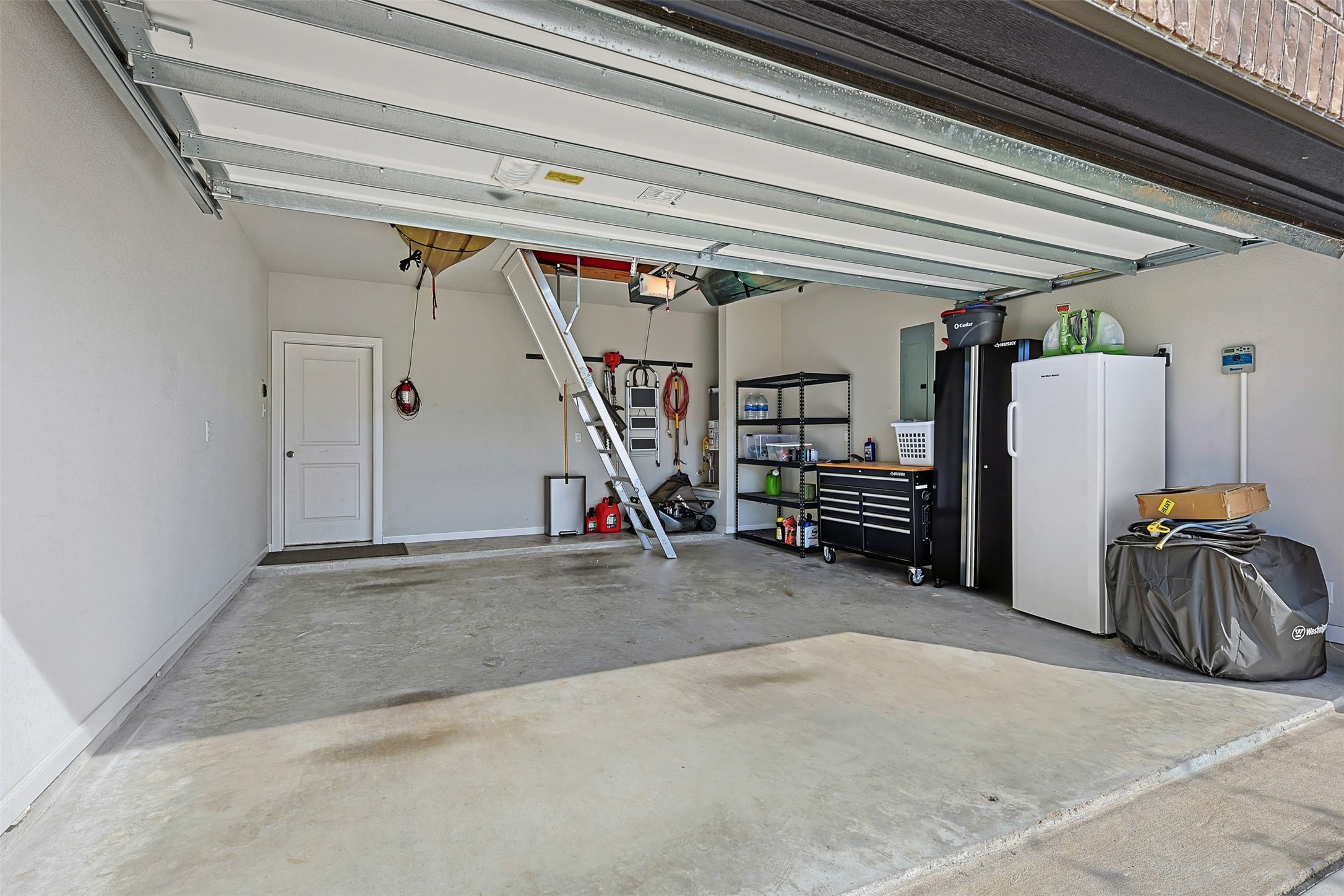 10003 Napier Drive Rosharon, TX 77583 - Photo 21 of 24 Well maintained garage with attic access