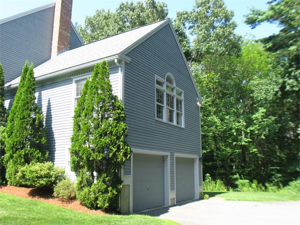 37 Patch Hill Road Boxborough, MA 01719 - Photo 16 of 22 a backyard of a house with plants and tree