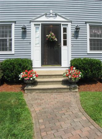 37 Patch Hill Road Boxborough, MA 01719 - Photo 18 of 22 a front view of a house with a yard and a garden