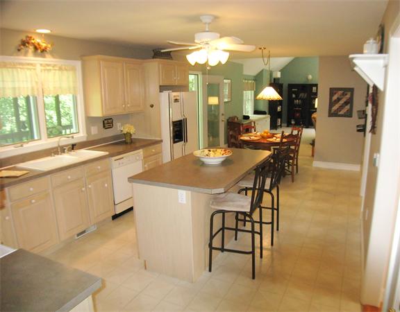 37 Patch Hill Road Boxborough, MA 01719 - Photo 4 of 22 a large kitchen with a table and chairs in it