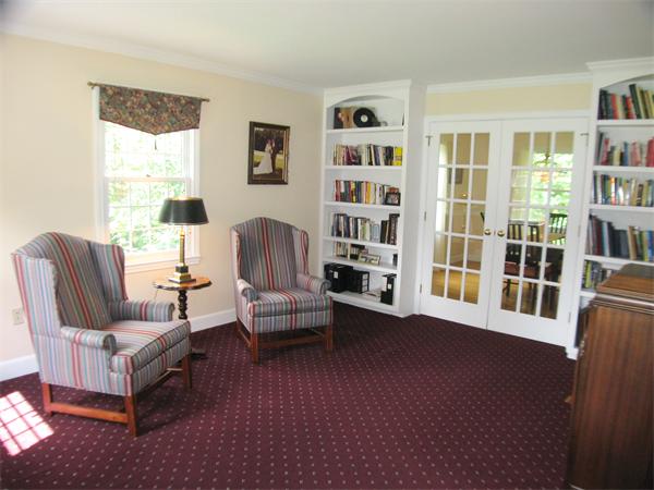 37 Patch Hill Road Boxborough, MA 01719 - Photo 5 of 22 a living room with furniture and a book shelf