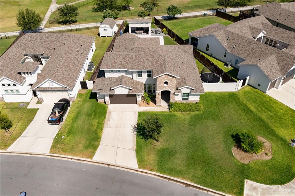 an aerial view of a house with a garden