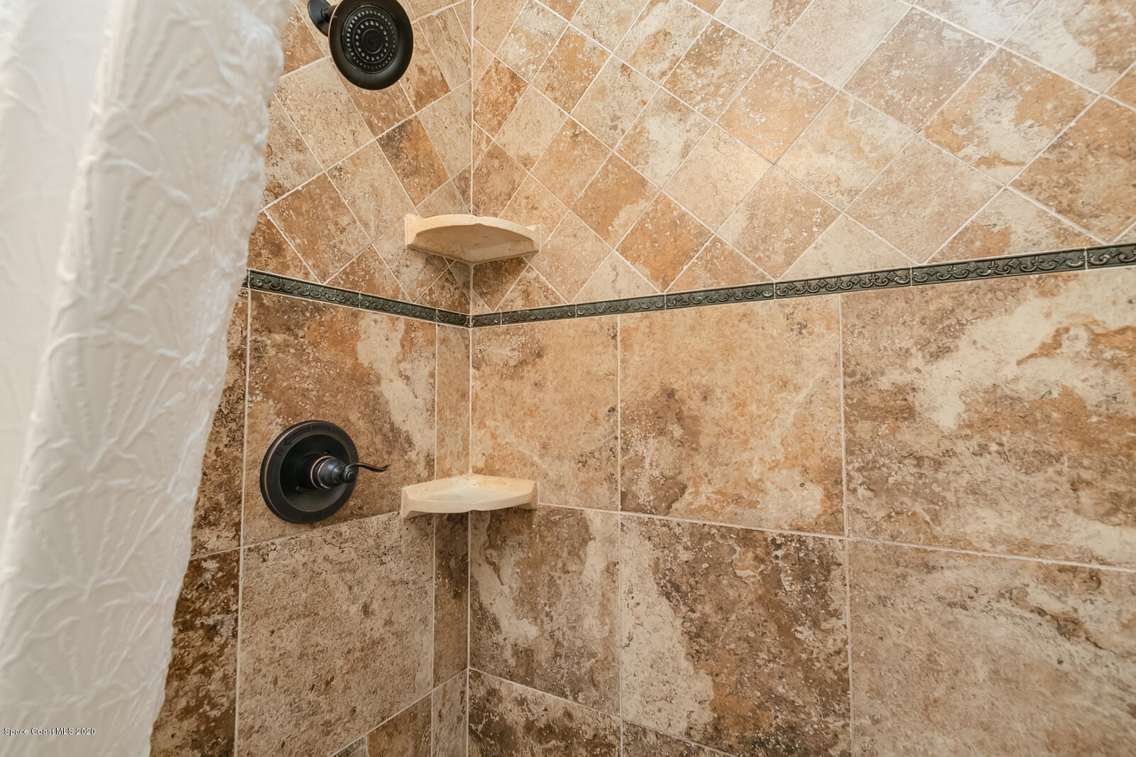 3316 Slate Street West Melbourne, FL 32904 - Photo 21 of 35 a bathroom with a shower and mirror