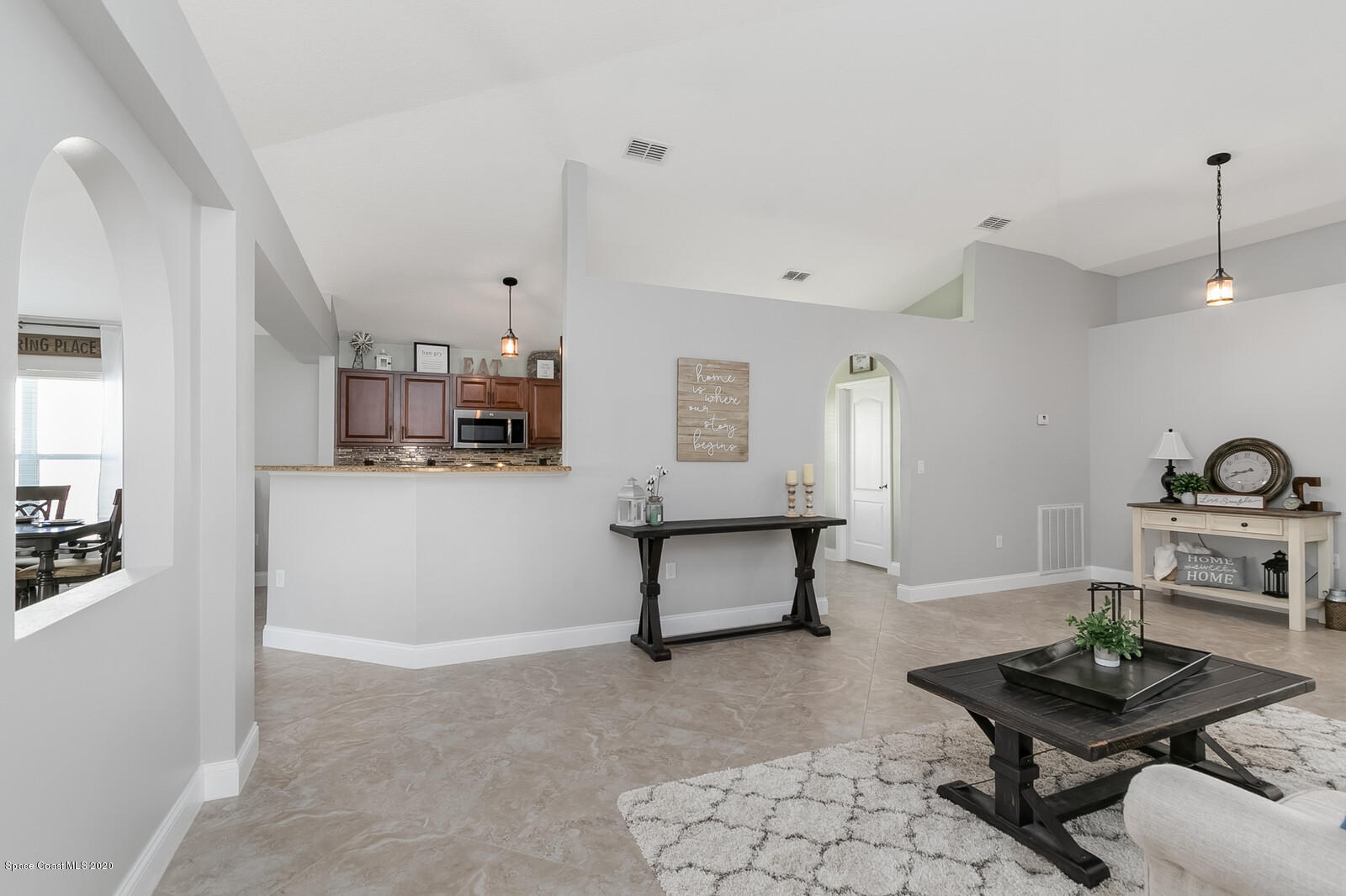 3316 Slate Street West Melbourne, FL 32904 - Photo 5 of 35 a living room with furniture and view of kitchen