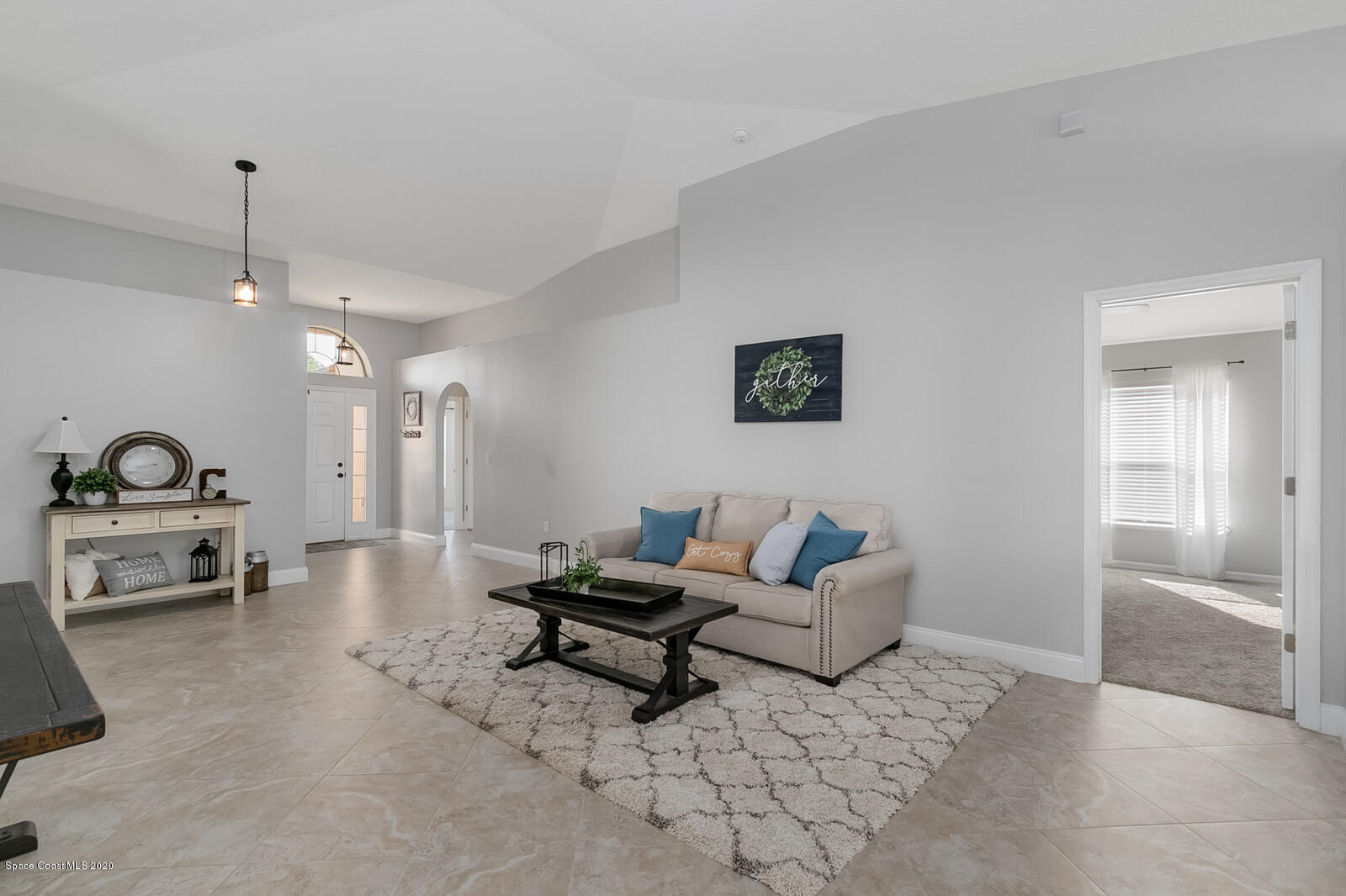 3316 Slate Street West Melbourne, FL 32904 - Photo 6 of 35 a living room with furniture and a lamp