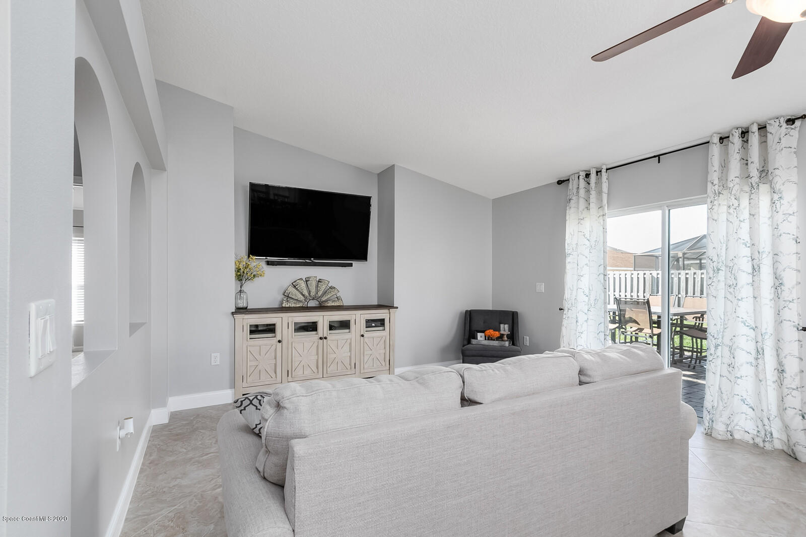 3316 Slate Street West Melbourne, FL 32904 - Photo 8 of 35 a living room with furniture and a flat screen tv