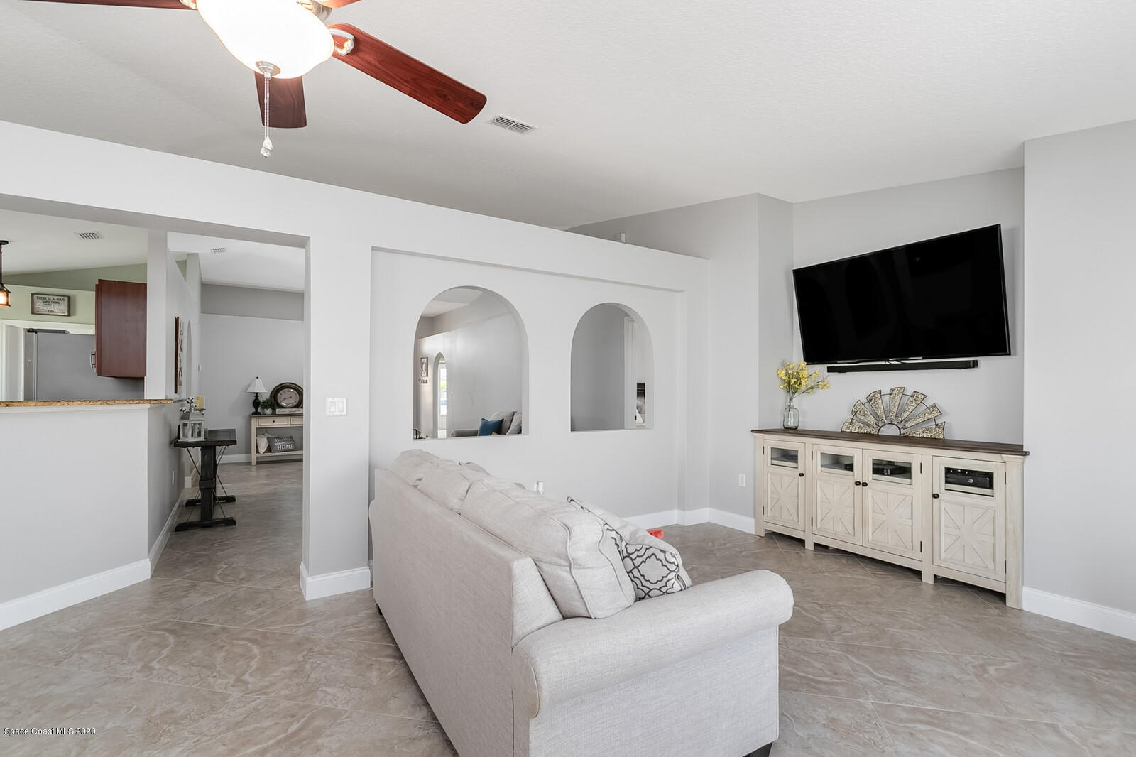 3316 Slate Street West Melbourne, FL 32904 - Photo 9 of 35 a living room with furniture and a flat screen tv