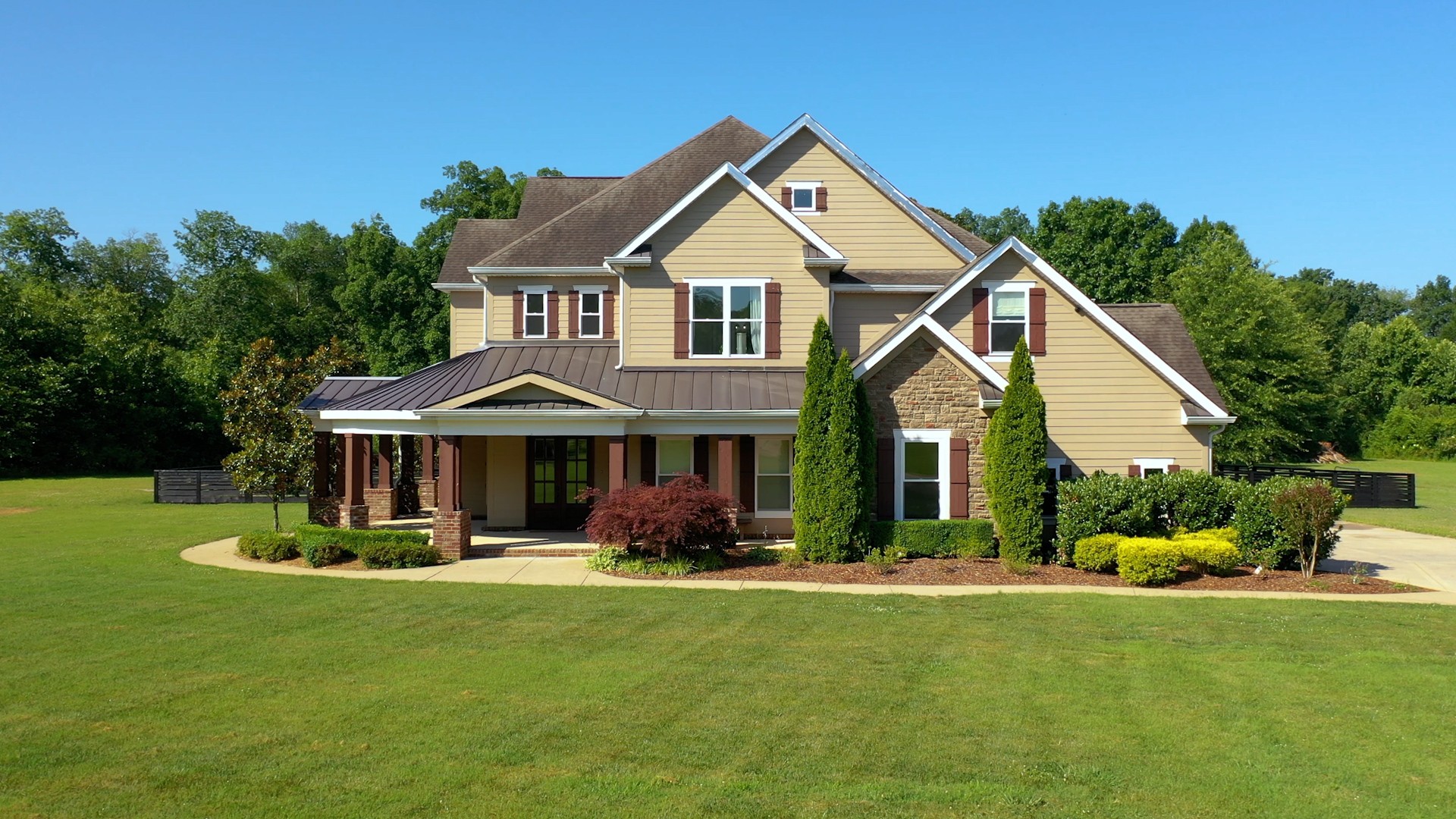 a front view of a house with a yard table and chairs