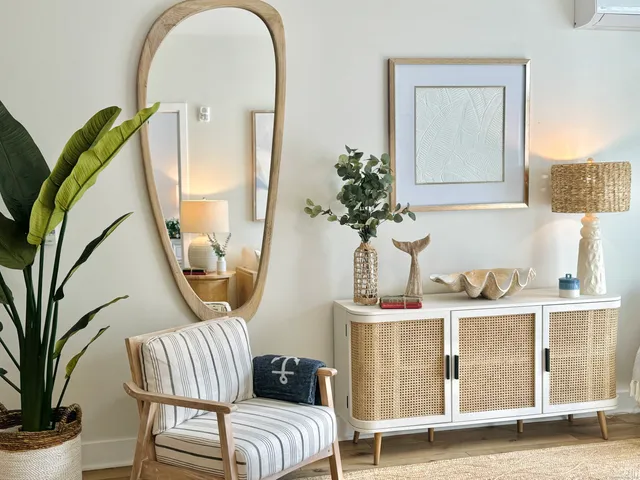 a bedroom with a bed and a mirror