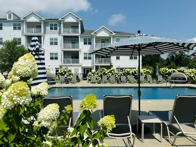 a view of a chairs and table in patio with a yard